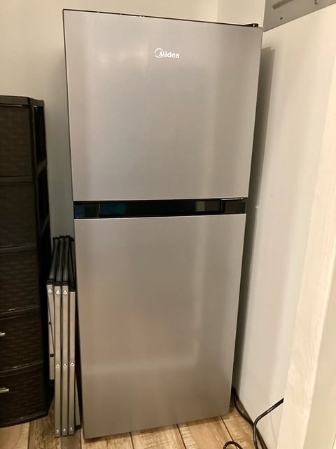 Mid-size fridge and separate freezer.