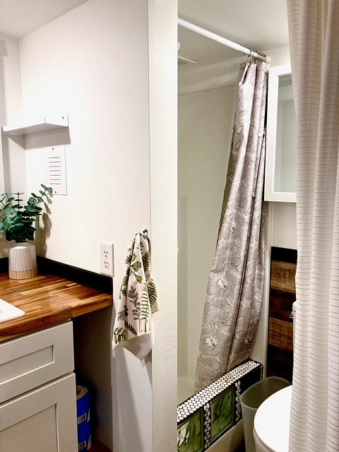 Standard shower stall with glass block accents that also help reduce splash.