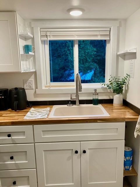 New kitchen, acacia countertop, cabinet storage, includes dishes, glasses, cups, etc.
