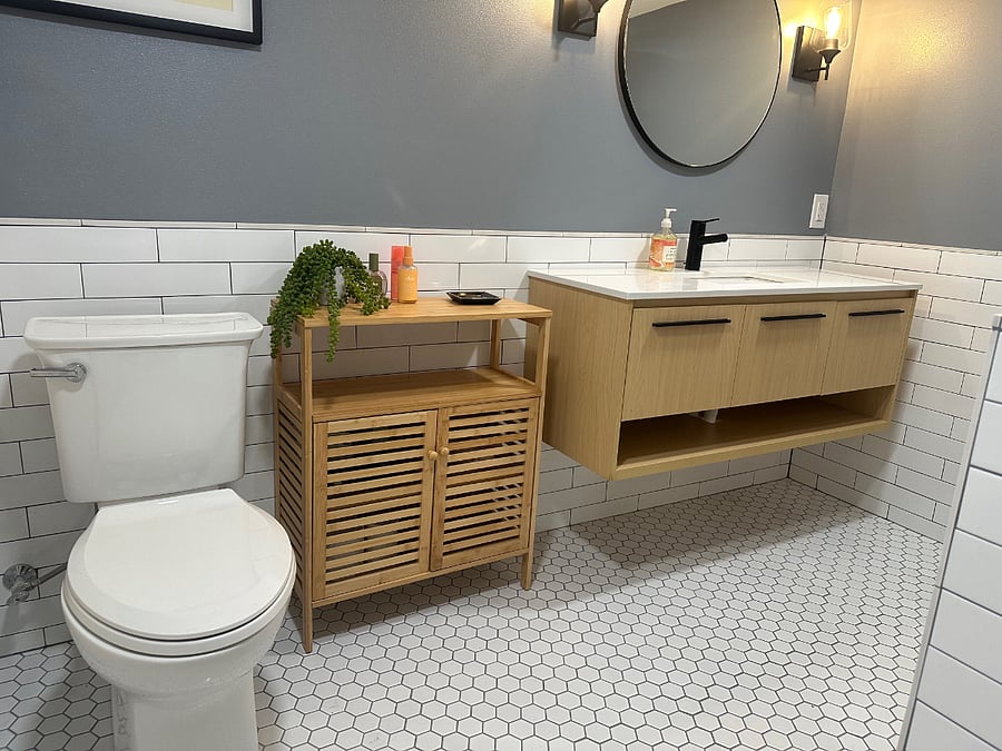 Bathroom is connected to bedroom through a pocket door - and includes plenty of storage space