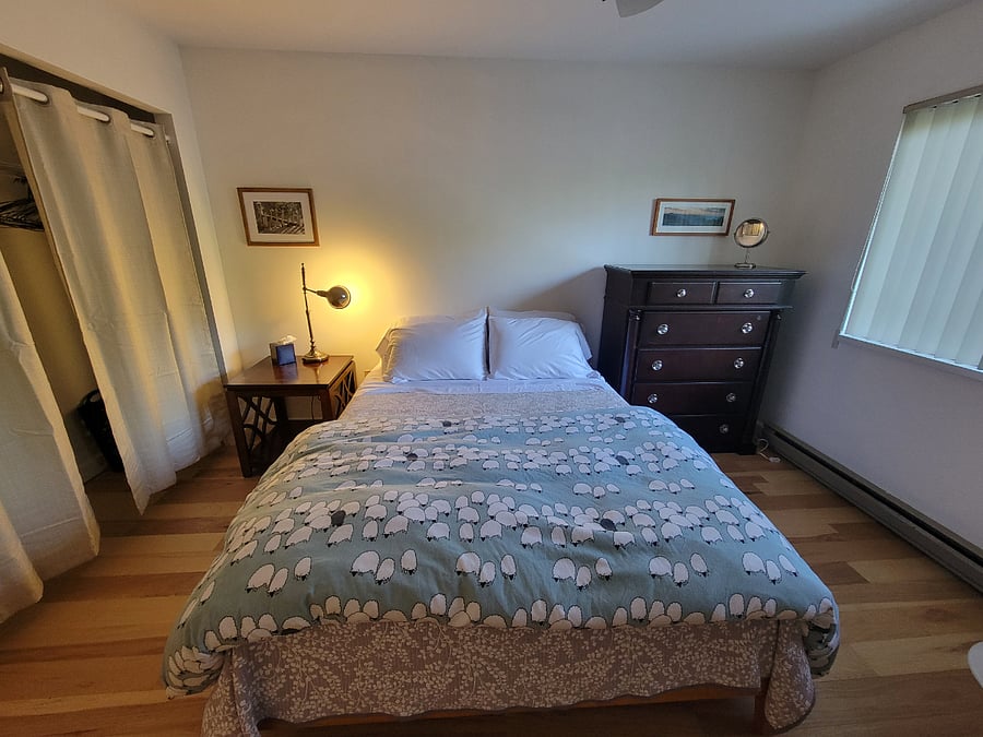 Queen bed with new mattress and bedding. Both warm and cool night comforters provided.