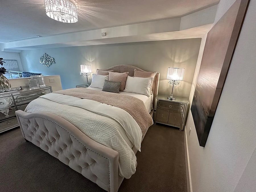 Upstairs primary bedroom (open loft style)