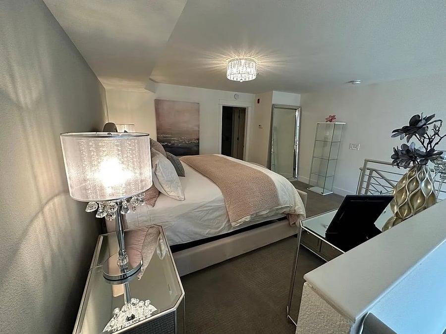 Upstairs primary bedroom (open loft style)