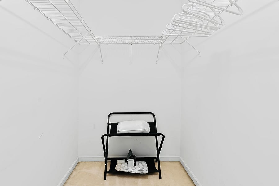 Attached to the Master Suit enjoy this walk in closet equipped with hangers for clothing, a suitcase rack, and an iron and foldable board to keep all attire crisp. There are 2 additional pillows to add additional comfort.