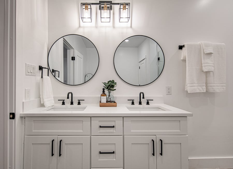 Master bathroom with Double sinks along with a full length mirror.