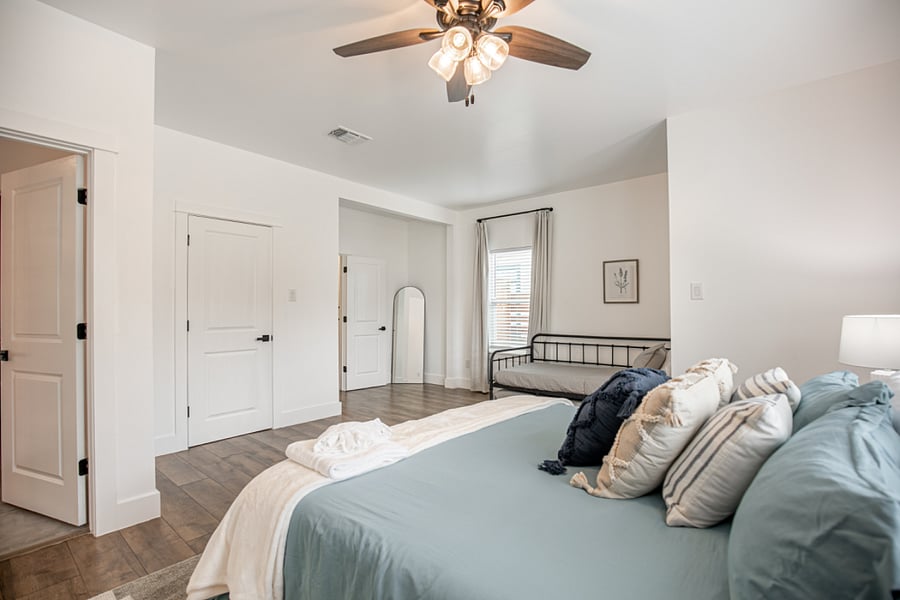 The second master bed room features a king bed, a trundle bed with 2 twin mattresses, an alarm clock, sound machine, and black out curtins. Hangers, luggage racks, and a Pack n Play are included in the closet.