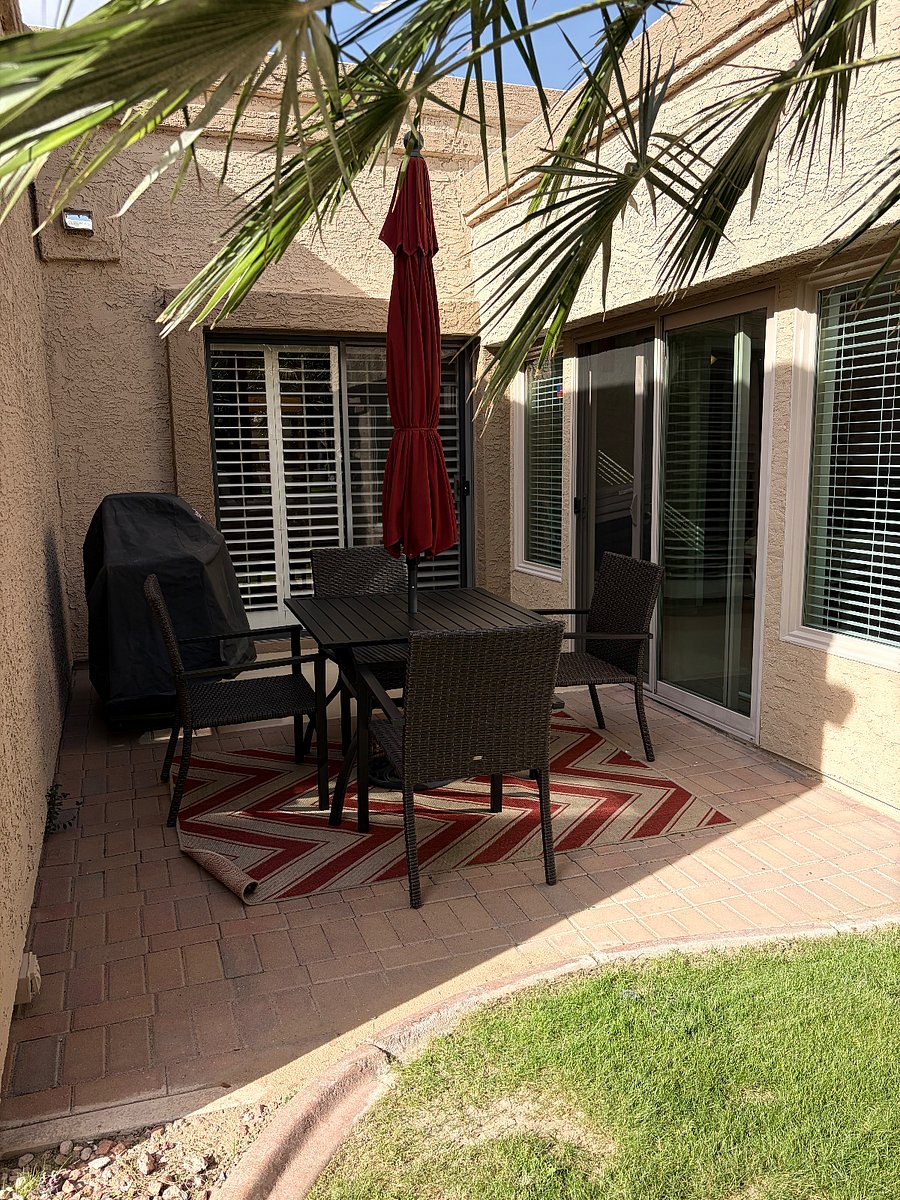 OUTSIDE PATIO AREA WITH ACESS TO SUN ROOM AND MASTER BEDROOM.
