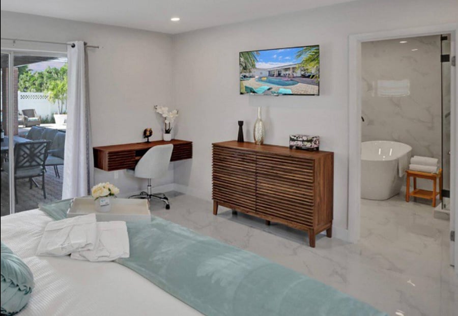 Master Bedroom with Desk ready for you laptop 
and sliding door to walk to the backyard pool area