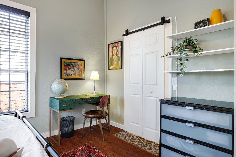 Bedroom 1 with desk and door to bathroom