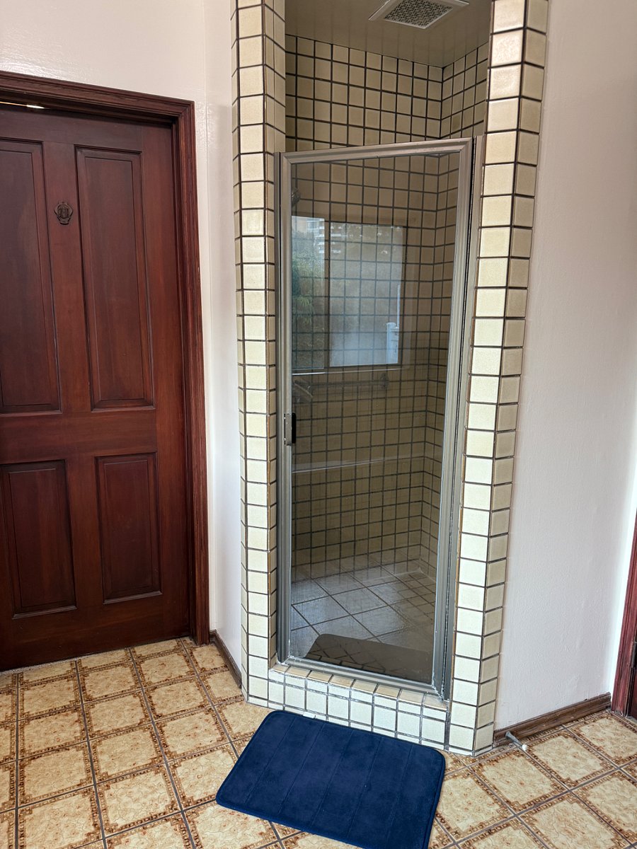 full bathroom with double sinks, bathtub and stand up shower.