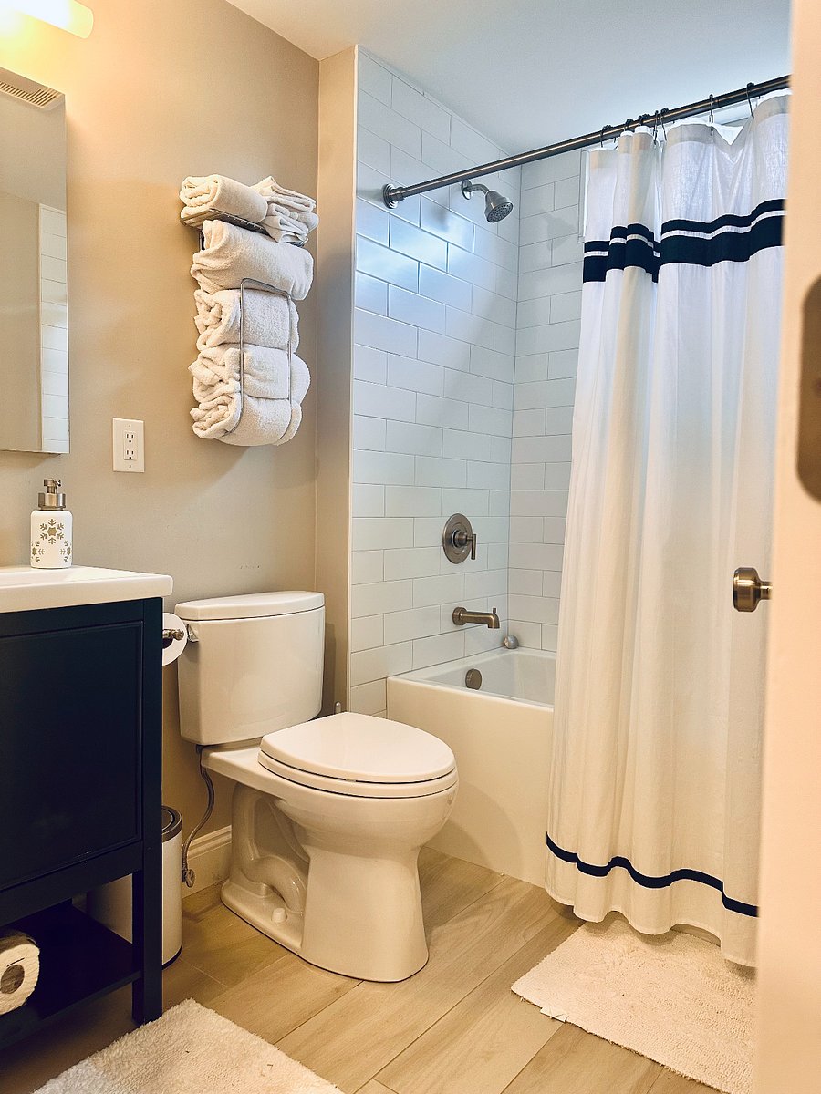 Second bathroom with tub/shower and vanity