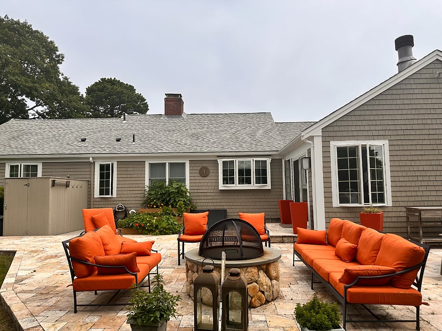 Back patio with fire pit and lounge seating