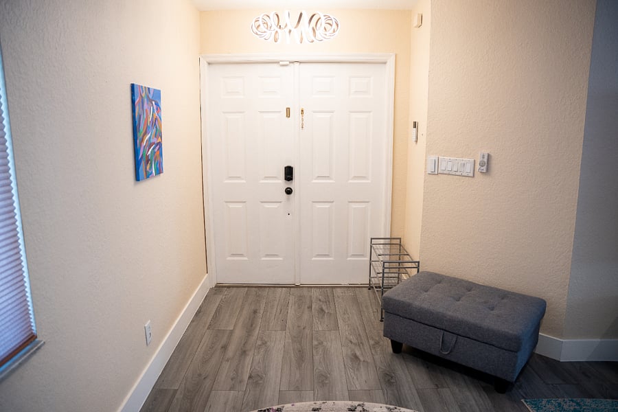 Front door with shoe rack and stool