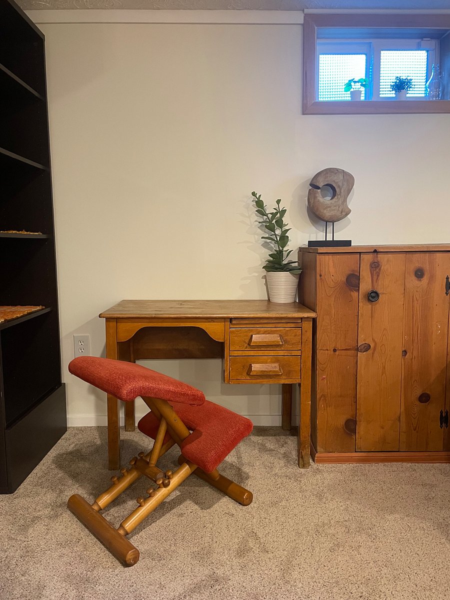 Small desk with vintage Norwegian chair (ergonomic) situated under a small, west-facing window