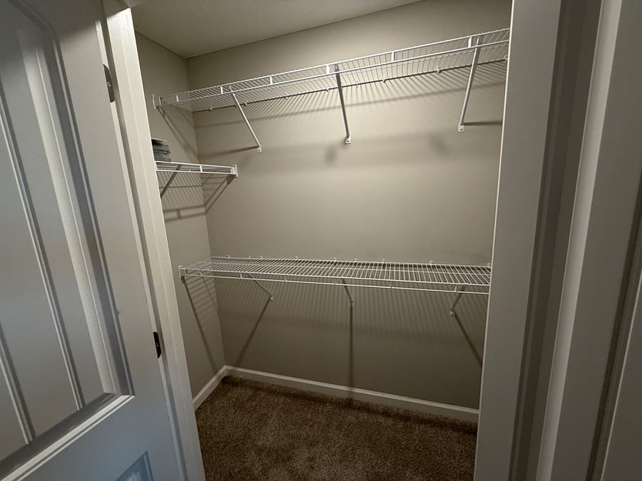 1 of 2 primary bedroom closets