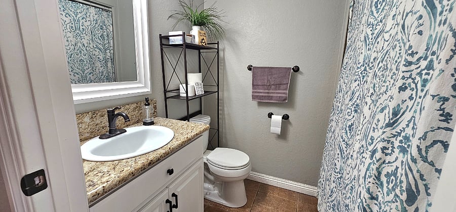 Downstairs Half Bathroom with In-Unit Laundry