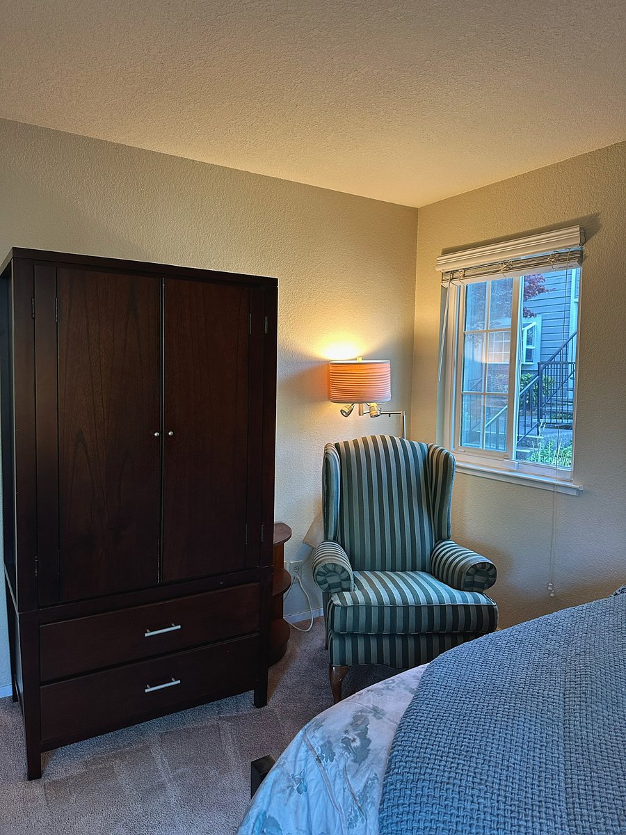 Secondary Queen Bedroom Corner Window Sitting Area