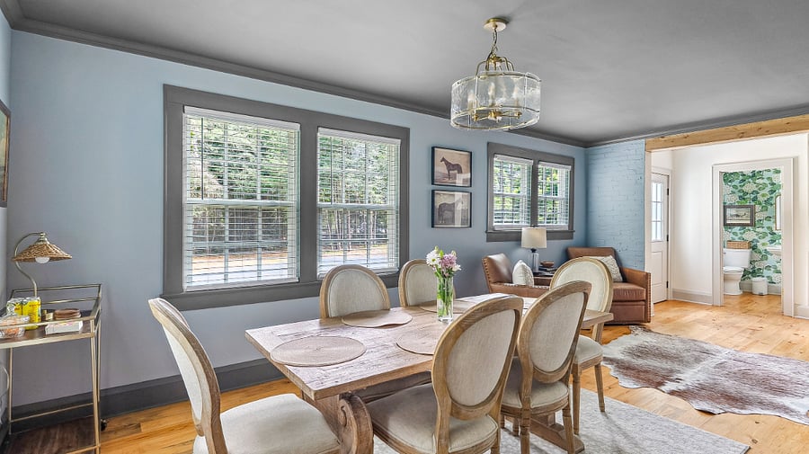 Dining area with club chairs and bar area