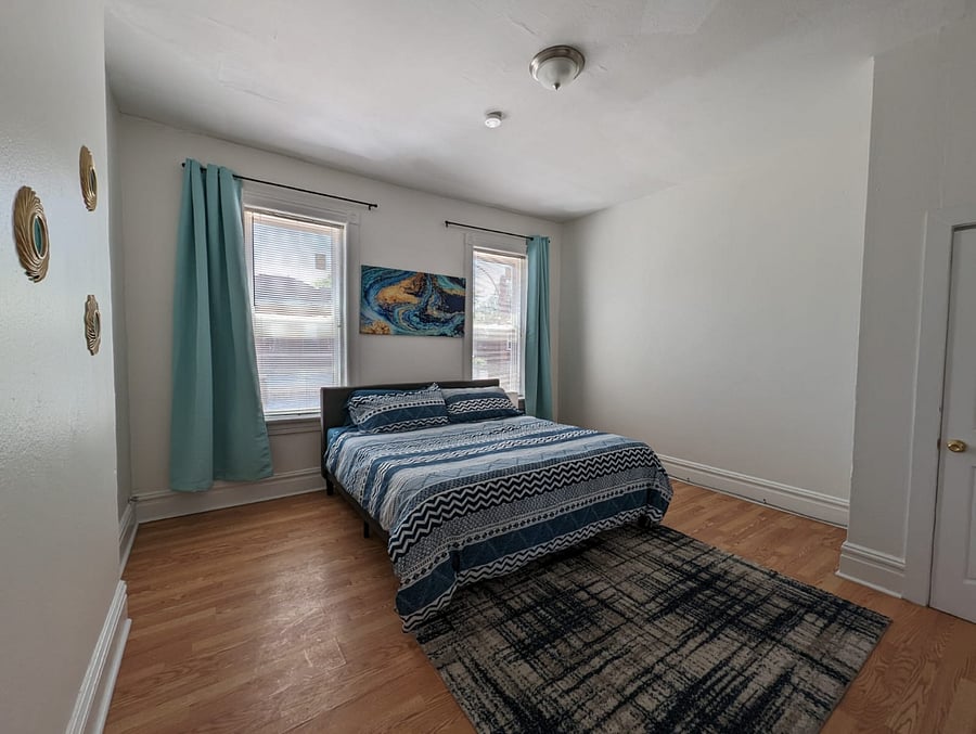 Enjoy our king-sized bedroom, where you can rest and recharge!