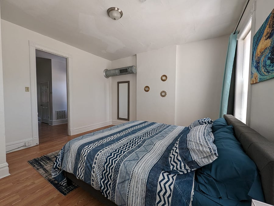 Enjoy our king-sized bedroom, where you can rest and recharge!