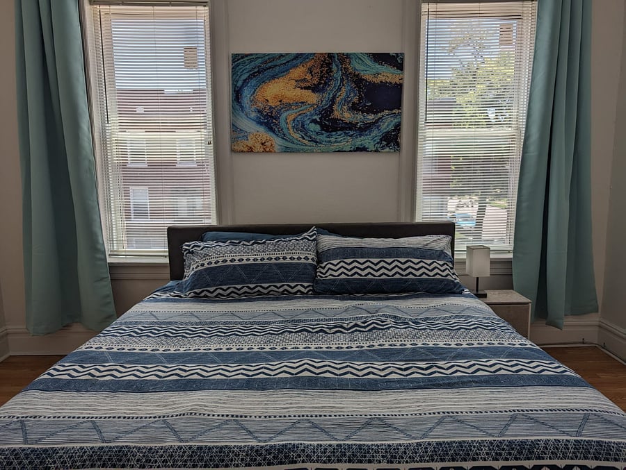 Enjoy our king-sized bedroom, where you can rest and recharge!