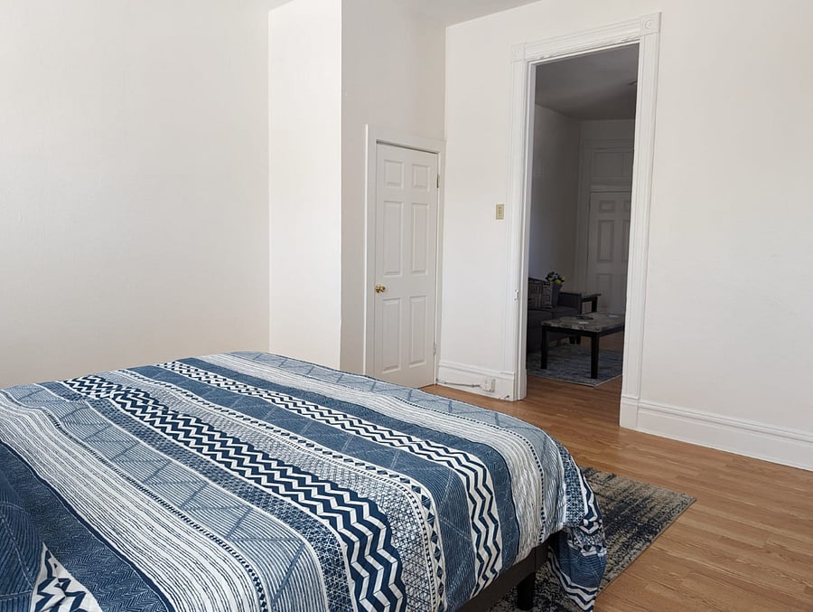Enjoy our king-sized bedroom, where you can rest and recharge!