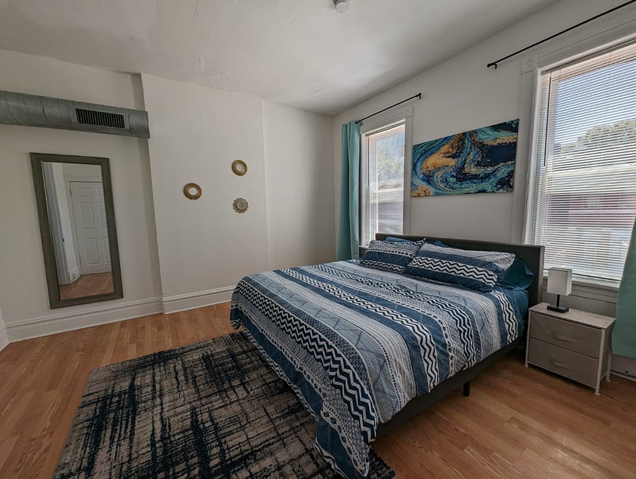 Enjoy our king-sized bedroom, where you can rest and recharge!