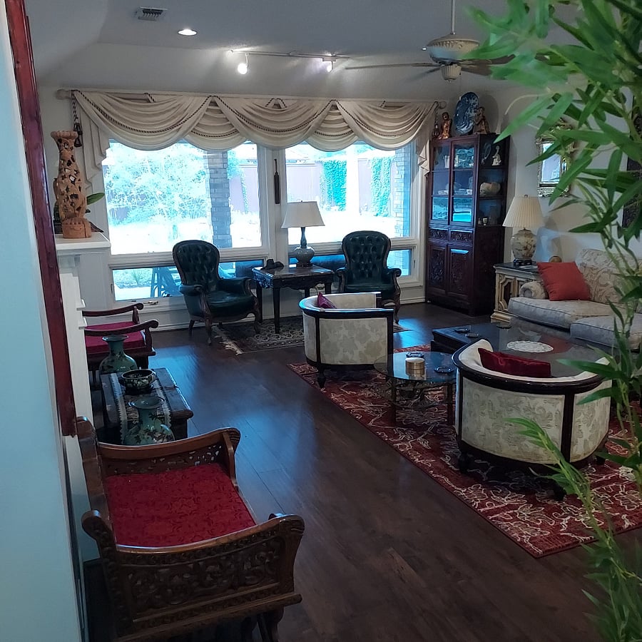 Living room with picture window with pool view