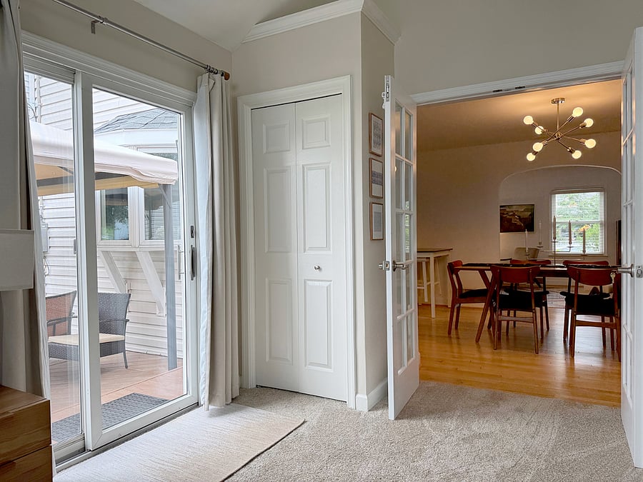 View from Main Floor Bedroom showing view of Back Deck, Closet, and Dining Room)