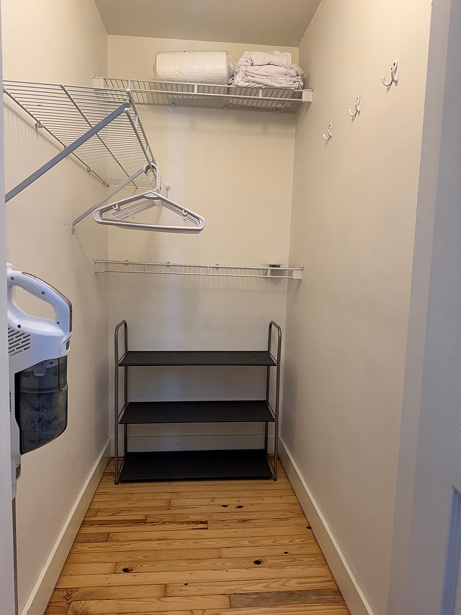 Upstairs Bedroom Walk-in Closet (also shows upstairs cordless vacuum)