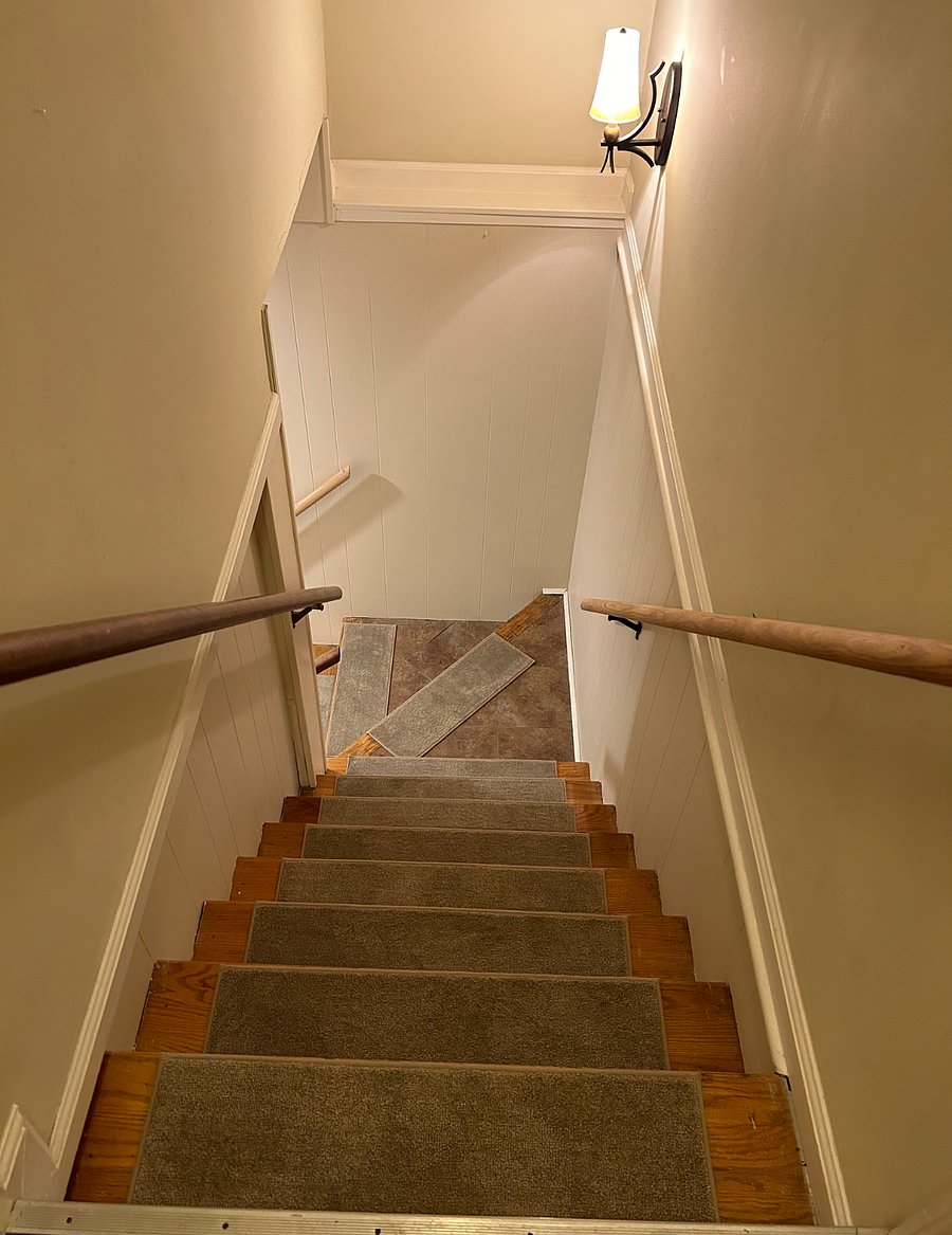 Stairwell off the garage door that leads directly to the tenant space.