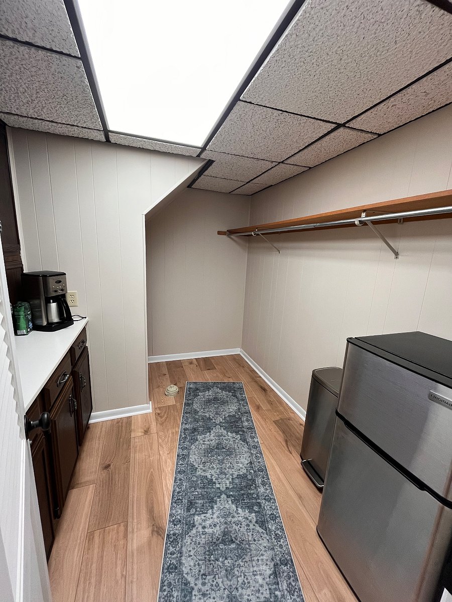 Back room off desk room for extra storage/hanging clothes. Mini fridge (with freezer) and coffee maker included.
