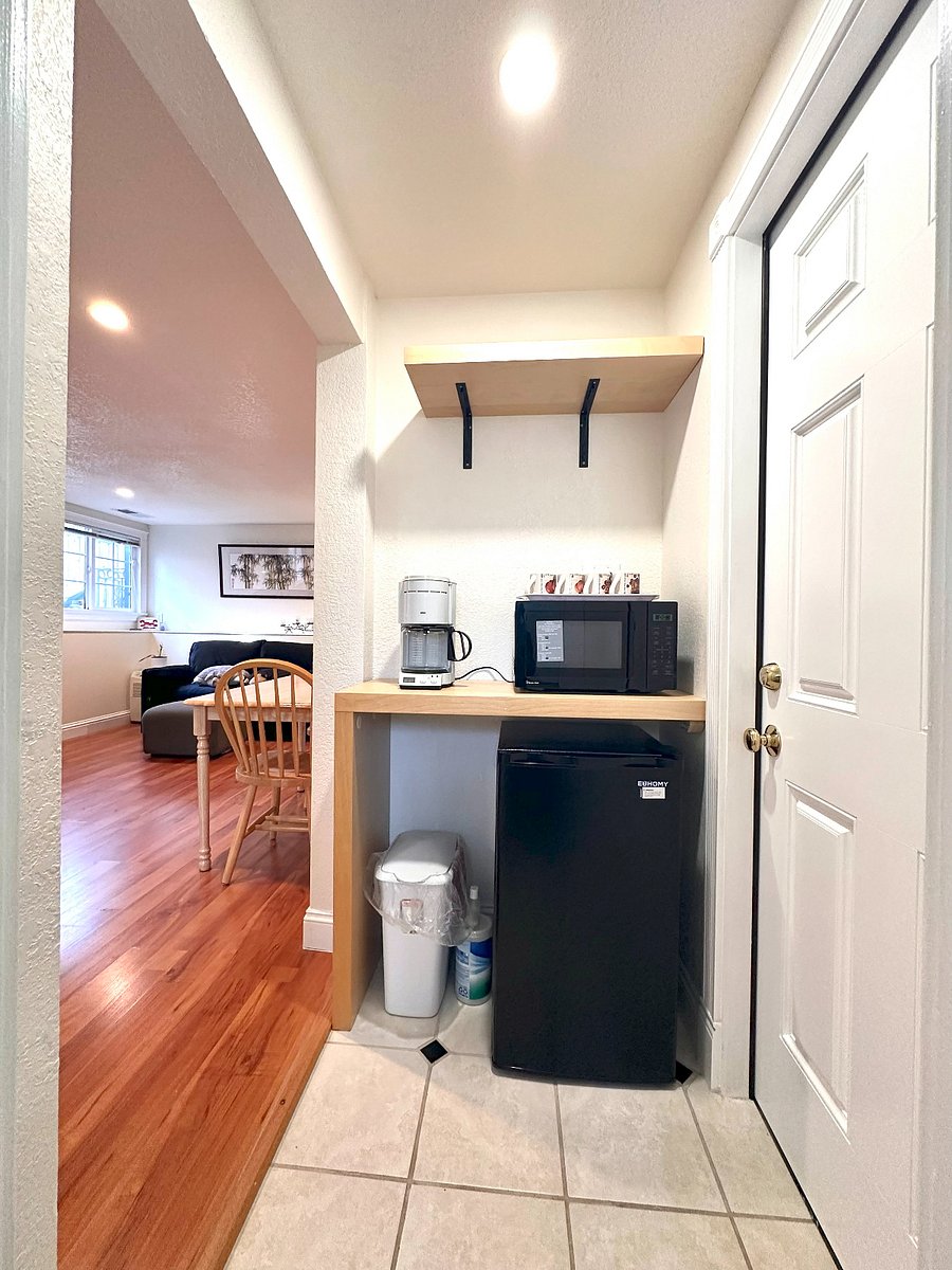 Kitchenette equipped with a microwave, refrigerator, and coffeemaker.
