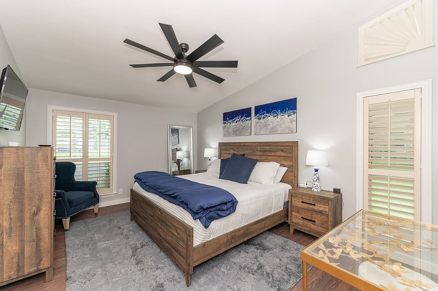 Relax in the spacious primary suite with king bed, plush linens, and calming blue tones your private retreat after a day of exploring San Antonio. Cozy reading corner with natural light perfect for morning coffee or evening wind-downs.