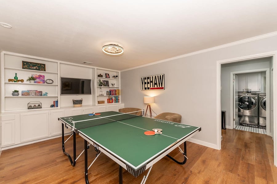 Kick back and compete in the dedicated game room, featuring a ping-pong table, TV, and classic board games. Perfect for rainy days, family tournaments, just hangouts with a Texas twist. YEEHAW spirit meets entertainment central laughter guaranteed