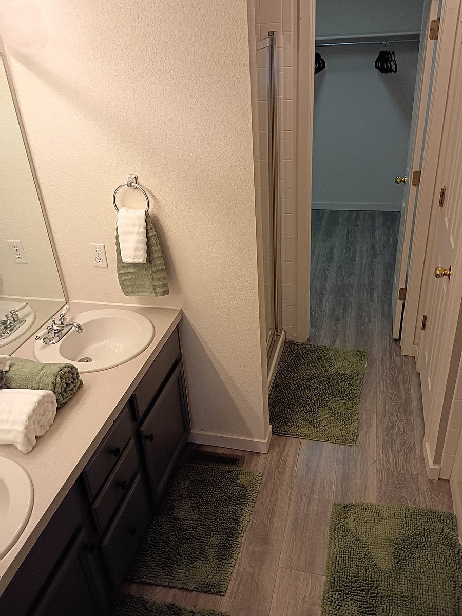 5 piece master bathroom with large walk-in closetBed