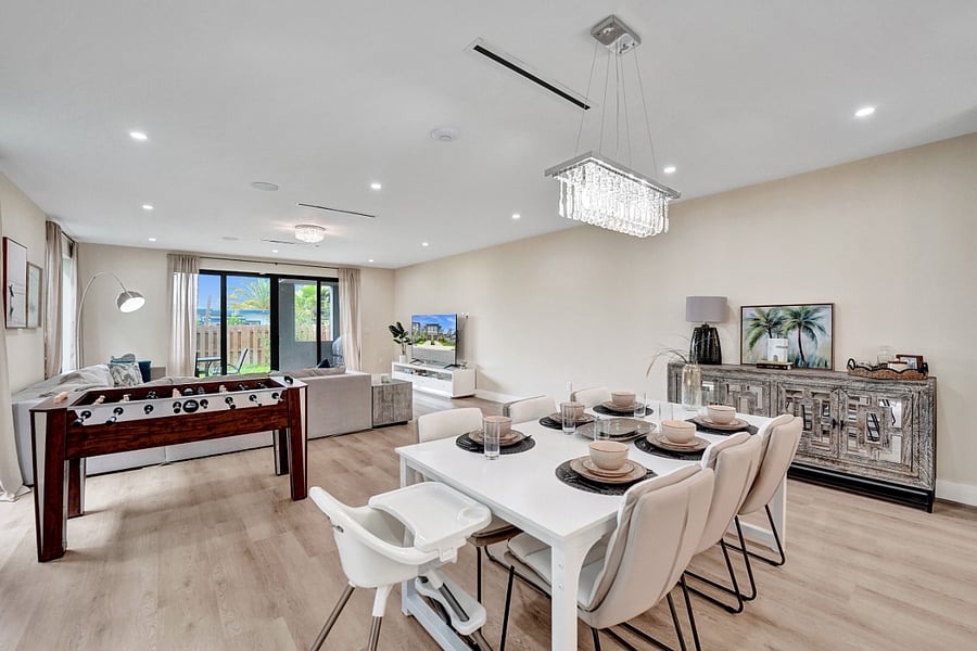 Elegant dining area with a table that seats eight, creating a cozy setting for memorable shared meals.
