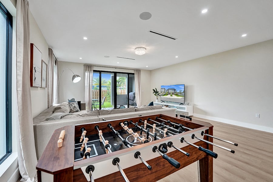 Challenge your friends to a game of foosball in the living room.