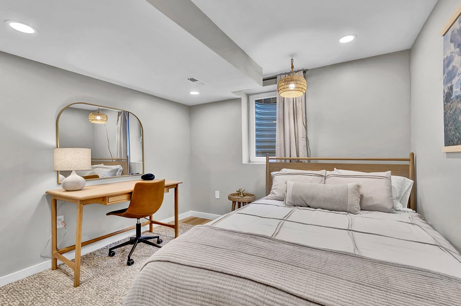 Queen bedroom with dedicated workspace. EXCELLENT WiFi for those working from home. Full closet for storage.