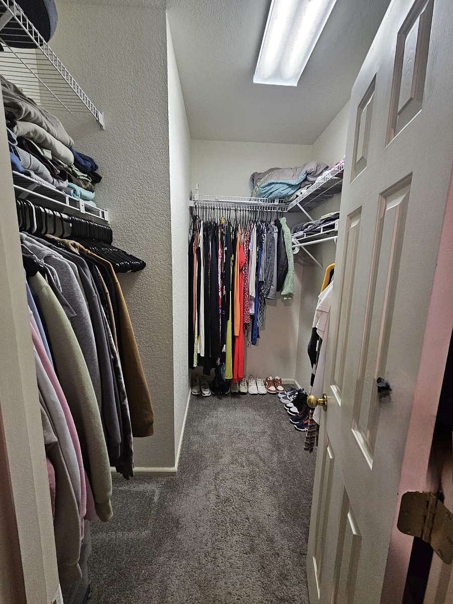 Walk-in closet in master bedroom *clothes will be removed