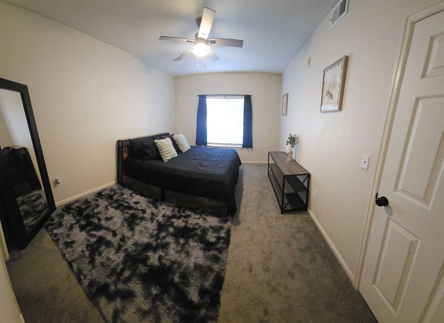 Master bedroom with large full length mirror