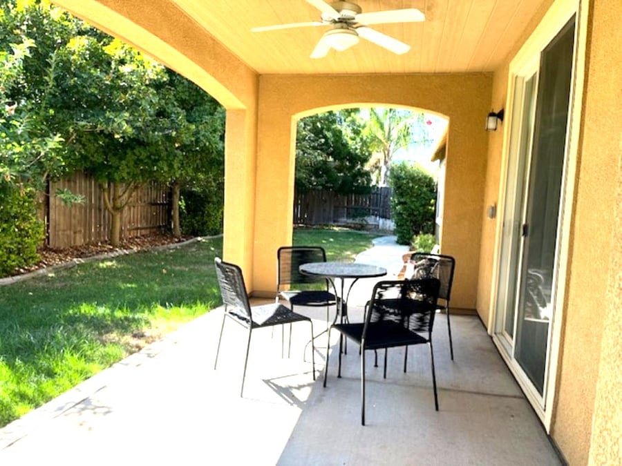 Covered patio  outdoor seating with  a coffee table for relaxing
