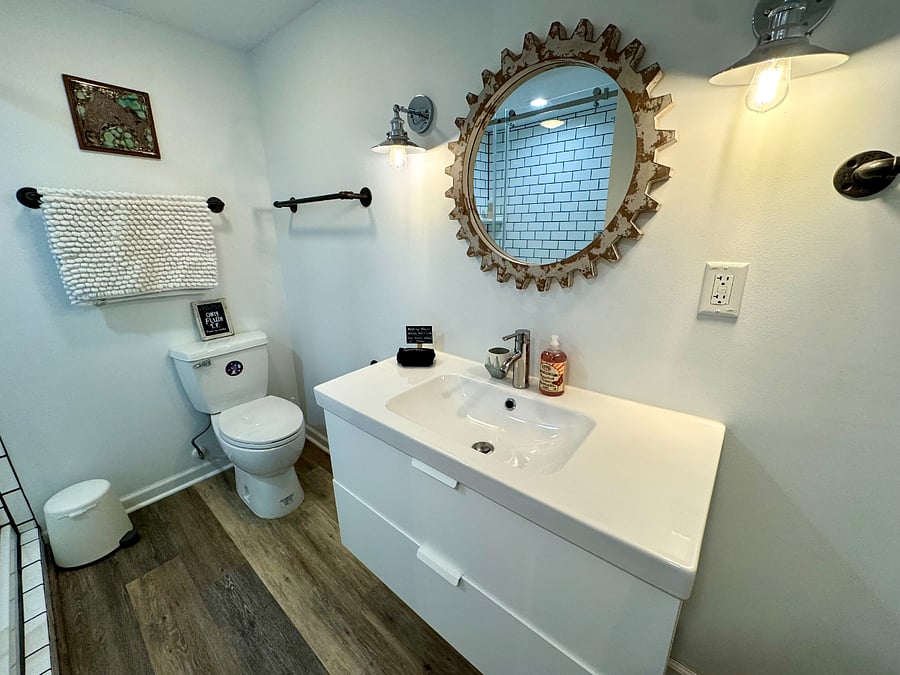 Your bathroom has plenty of storage in the vanity, and includes its own heater and vent.