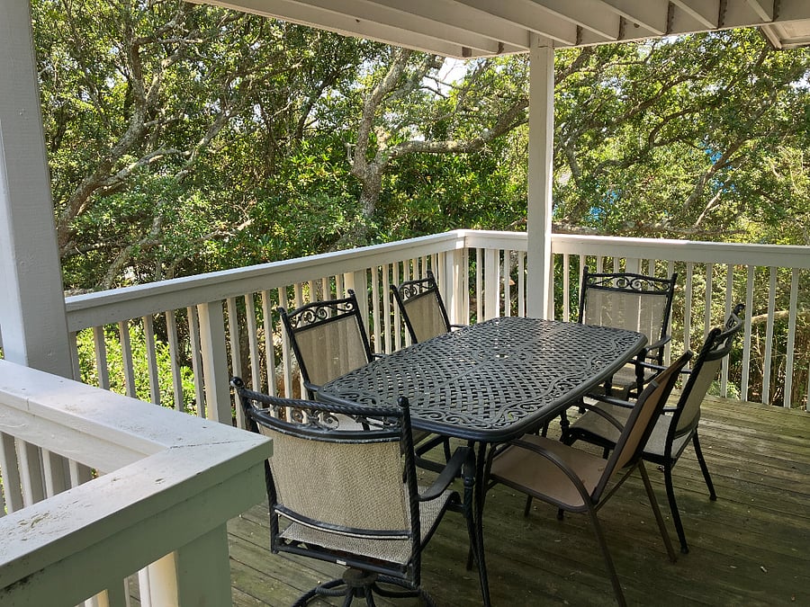 back porch with table and chairs