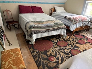 2nd floor bedroom. Sleeps 5 Dorm style or small family (May - Early October) 1 Full bed and 3 singles. 2nd floor is closed off during the months of November - Late April).