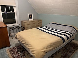 Larger 2nd floor BR. Has one full bed and one single bed. Can sleep anywhere from 1 - 3. Late April - Mid October. / 2nd floor is closed off from Mid- October- Late April ),