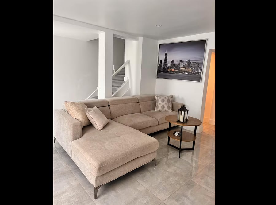 Relax in a cozy, tropical-inspired living room with a clean and minimalist design.