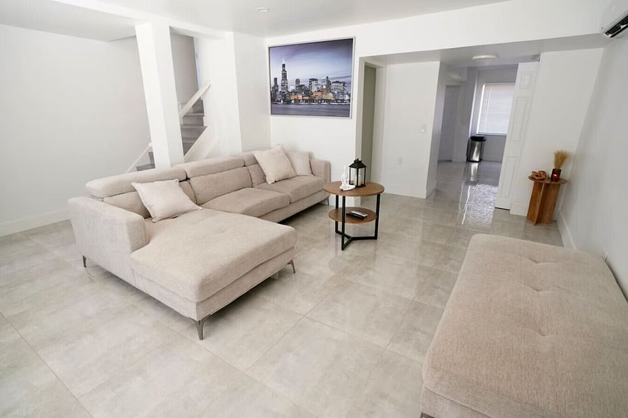Relax in this cozy, tropical-minimalist living space designed for comfort and calm.
