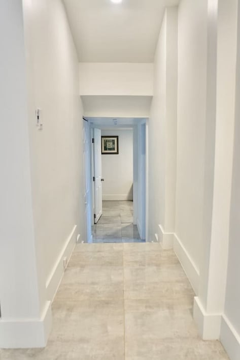 Spacious hallway leading to the cozy bedrooms and shared living spaces.