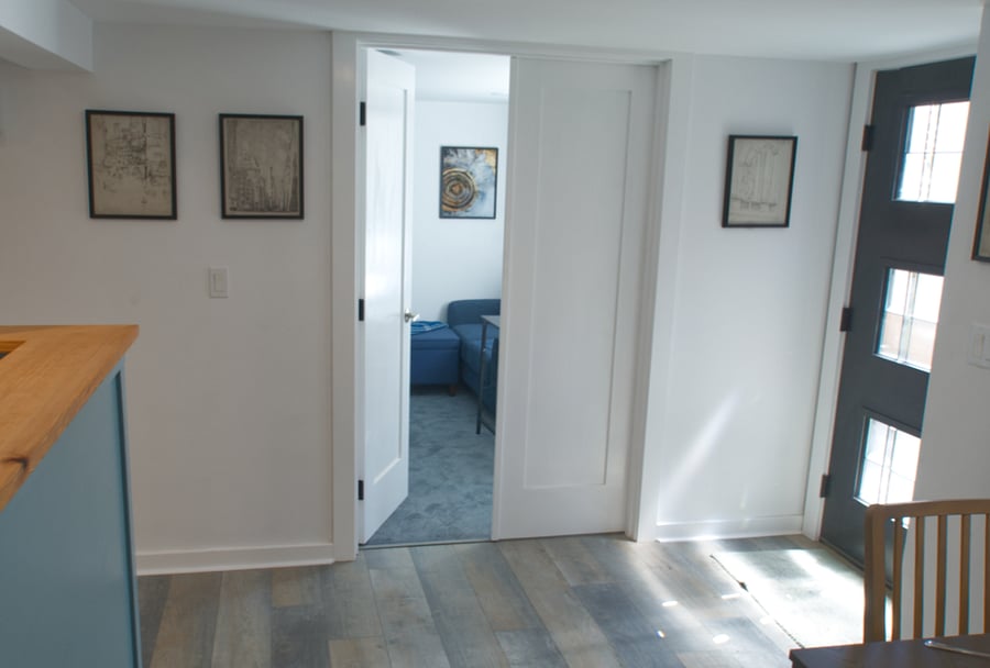 Each bedroom suite's double doors can open to central kitchen/dining for larger flow between daytime spaces.